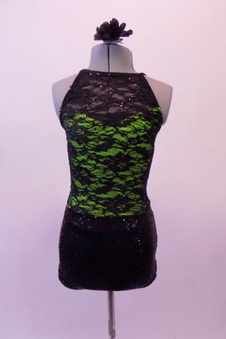 Beautiful black lace and sequined halter neck, short unitard has a green base beneath the sequined lace. The attached shorts are black sequined with lace waistband. Comes with a black floral hair accessory. Front