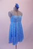 Pretty blue sequined sheer lace costume has an empire waist and gathered bust. The crystal covered double straps cross over at the back and provide a bit of bling. Comes with a floral hair accessory. Side