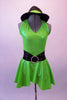 Neon green halter collar dress has double crystaled vertical back straps.  The dress has a wide black waistband with circle crystal buckle accent. Comes with matching hat accessory. Front