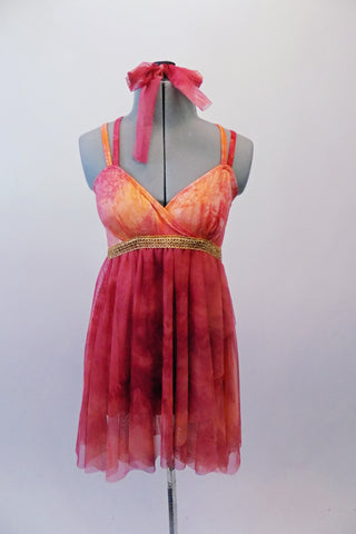 Marbled red and burnt orange coloured dress has an Empire waist with thick gold banding and crossover bust. The double thin straps cross over at back. The sheer flowing chiffon skirt falls just above the knee. Comes with matching hair tie. Front