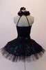 Stunning black sequined lace tutu has a ruffled halter collar neck with a shimmery teal underlay with sweetheart bust. The back has vertical angled straps for support. The bodice and overlay are attached to the six-layer black pleated tutu. Comes with a black floral hair accessory. Back