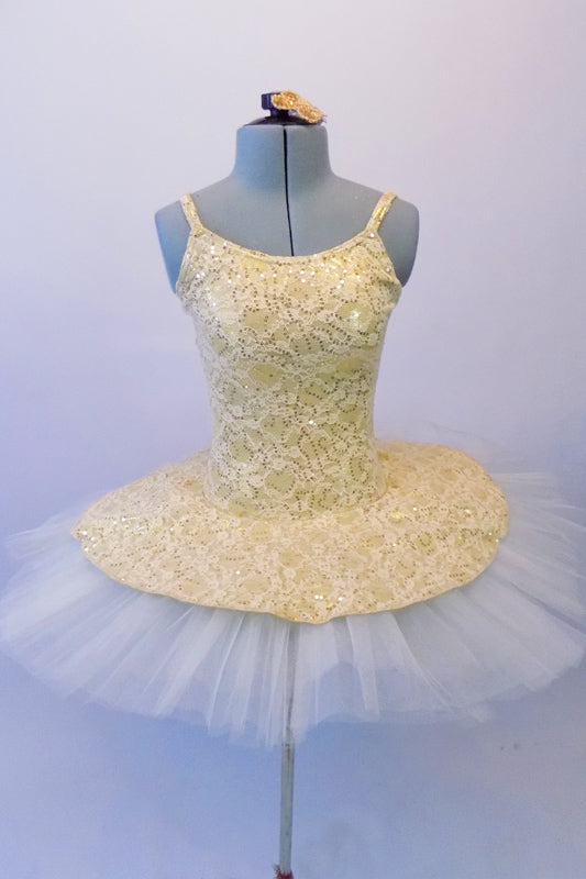 Ivory pleated six-layer platter tutu has a gorgeous creamy gold beaded lace attached bodice and overlay. Comes with a floral hair accessory. Front