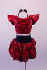 Two-piece black & red tiger stripe costume has a choker style collar attached by a series of straps covered in Swarovski crystals. The padded shoulders create a dramatic flair. The matching bottom is a high-waisted brief with crystal designs & pouffe bustle. Has red lace draping at the front. Comes with hair accessory. Back