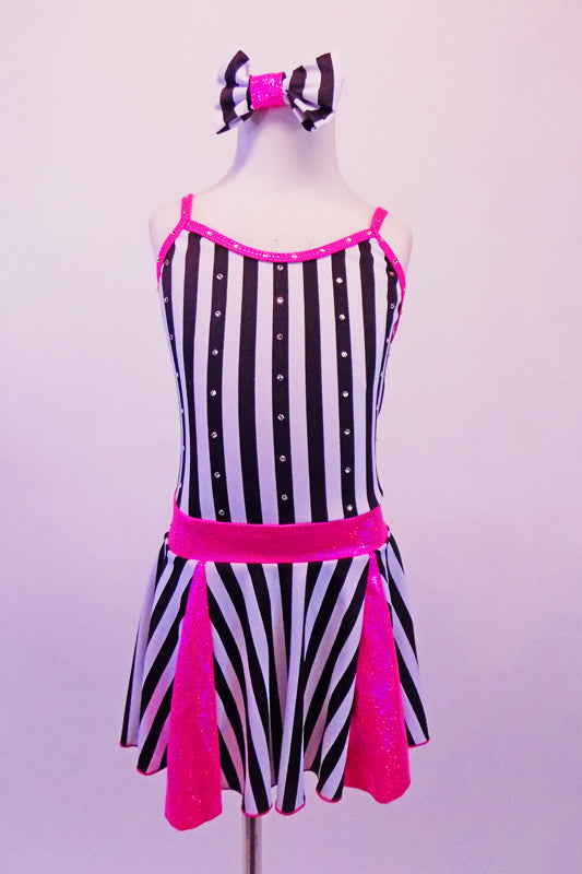 Sweet black and white vertical striped dress had bright pink inlays in the skirt, a pink waistband and crystal crystal-lined, pink binding. The front of the dress is lined with Swarovski crystals as are the triple back straps. Comes with matching striped hair bow and pink gauntlets. Front