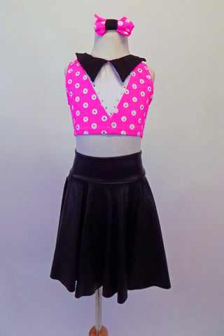 50’s inspired two-piece costume has a black knee-length circle skirt paired with a cute pink and white polka dot half top with black collar covered in each dot with Swarovski crystals. To complete the outfit there are black stretch footless socks with pink bows, pink polka dot wristlets and matching polka dot hair bow. Front