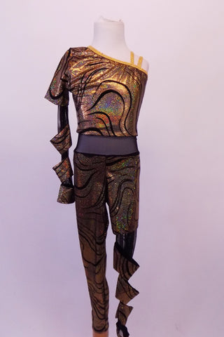 Gold and black swirled iridescent unitard has black sheet midriff and single shoulder with one long sleeve. The left leg and right sleeve are sheer black mesh with attached tube-like matching fabric twists. Clear straps support the other shoulder. Front
