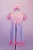 Empire waist dress has pale sequin speckled pink bust with pouffe sleeves. The knee length white flowing skirt had a matching pink ruffle and bow accent. Comes with pale pink hair bow clip. Front