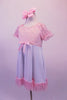 Empire waist dress has pale sequin speckled pink bust with pouffe sleeves. The knee length white flowing skirt had a matching pink ruffle and bow accent. Comes with pale pink hair bow clip. Side