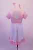 Empire waist dress has pale sequin speckled pink bust with pouffe sleeves. The knee length white flowing skirt had a matching pink ruffle and bow accent. Comes with pale pink hair bow clip. Back