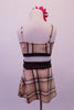 Two-piece tartan costume is a blend of cream brown, white and red. The brown banding along the bust compliments the waistband of the faux wrap short skirt. Comes with a floral hair accessory. Back