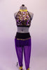 Costume has purple harem pants with gold coin trim hip accent. The halter style fully sequined half-top has double gold and black angled back straps. Comes with a gold hair accessory. Front