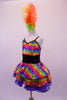 Rainbow coloured dress has black sequined waistband and crystal-lined bustline. The attached skirt has colourful layered, sequin edged ruffles of red, blue and green. Comes with large colourful feather hair accessory. Side