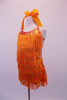 Orange fully fringed dress has crystalled neckline and tie-up halter collar. The deep low back has a wide mesh crystal lined horizontal band. Side