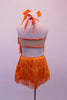 Orange fully fringed dress has crystalled neckline and tie-up halter collar. The deep low back has a wide mesh crystal lined horizontal band. Back