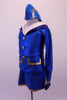 Royal blue flight attendant costume has slit short skirt and long-sleeved jacket with gold buttons and braided trim. The large white and blue crystal lined collar and deep blue cuffs add that much-needed detail. The costume is completed by a blue and gold airline hat. Side