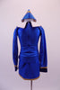 Royal blue flight attendant costume has slit short skirt and long-sleeved jacket with gold buttons and braided trim. The large white and blue crystal lined collar and deep blue cuffs add that much-needed detail. The costume is completed by a blue and gold airline hat. Back