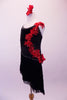 Black sequined dress is lined with crystals along the neckline and straps. The angled skirt is comprised of layers of black fringe lined at the hip by crystals. The left side of the torso from shoulder to hip is covered with a cascade of red 3-D floral sequined appliques. Comes with a red floral hair accessory. Side