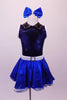 Blue-black costume has a diamond sequin bust with white trim open back and black leatherette crystalled collar. The attached blue skirt with crystal scattered organza overlay has a white belt with crystal buckle. Front