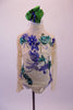 Ivory lace, open back leotard has closed high neck closed front and long lace sleeves. The leotard in covers with 3-D floral appliqués in royal blue and emerald green. Comes with a green and blue ribbon style hair accessory. Front