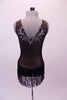 Brownish-grey V-neck leotard has gold-edged silver appliqués covering the entire front torso in a paisley-like pattern. The low V-back has matching paisley appliques which compliments the sequined fringe skirt. Comes with a hair accessory. Back
