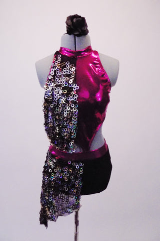 Short unitard gives the appearance of a 2-piece. The metallic fuchsia pink halter top is covered along the right front and hip by a circular chain-like cascading sequin fabric. The top is attached to the shorts at two points in the front.  Open back has two vertical straps. Comes with a black floral hair accessory. Front