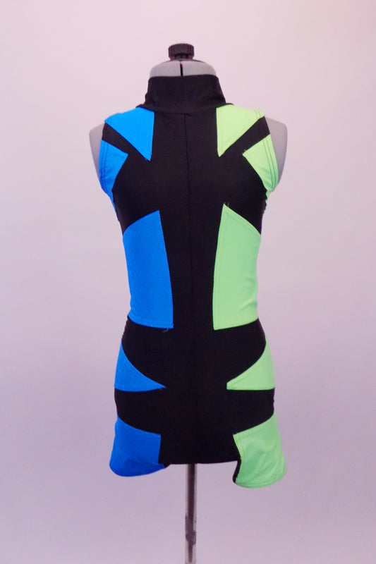 Futuristic short unitard has a turquoise right side and a pale green left side. The two sides are divided by an intricate geometric pattern of black that is a mirror image at the front and zip-close back. Gives the appearance of a mirror or silhouette. Front