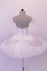 Snow white professional pleated & hand tacked 9-layer pancake tutu has attached bodice. The tutu has a triple scallop overlay with alternating white & silver sequined lace. The tutu is scattered with Swarovski crystals. The attached bodice is a deep front sweetheart cut with nude mesh centre inlay & lined with lace and crystals. Back