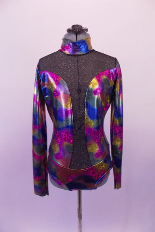 Long-sleeved high collar leotard in is iridescent fuchsia, blue charcoal & amber with a glittery black sheer mesh at front shoulders that extends down the front centre to hip. The sweetheart bust opens to reveal mesh that hugs the sides. Low, open back has two black vertical straps & one horizontal at mid back. Front