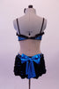 Blue & black leotard has a blue lace bra with black lace ruffle, crystal accents & bow front detail. The torso with open back and sides has a faux corset front, lined down the sides with crystals. The attached blue mini skirt is covered with layers of this black mini chiffon ruffle &has a large blue bow at the back. Back