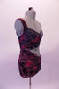Two-piece costume has a purple, red and grey marbled sarong style half top and skirt as the base. The top crosses over the right bust with silver accents and wraps asymmetrically and ties up at the left back. The left bust reveals a beautiful hand painted purple-grey bra. Right side