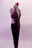 Deep burgundy velvet halter unitard has a deep open front held together by two centre straps just below the bust. The front is intricately decorated by hand painted designs in pink & purple surrounded with crystal accents. The open sides & back are piped in pink. Comes with a floral hair accessory. Right side