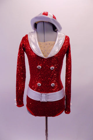 Bold, bright red fully sequined long-sleeved leotard had white lapel collar & belt with crystal buckle accent. The front has crystal accents & four large crystalled buttons on the torso. The back is a large open keyhole style and the costume is completed by a red and white sequined striped hat. Front