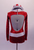 Bold, bright red fully sequined long-sleeved leotard had white lapel collar & belt with crystal buckle accent. The front has crystal accents & four large crystalled buttons on the torso. The back is a large open keyhole style and the costume is completed by a red and white sequined striped hat. Back