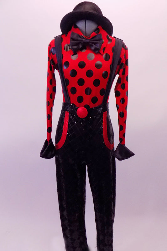 Red long-sleeved leotard with large black polka dots &red button cuffs has a collar and bowtie. The matching diamond sequined print pants have attached suspenders held in place by keepers at the shoulder. The pockets are edged in red & match the large red front button. Comes with a black bowler hat. Front