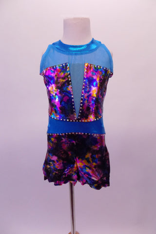 Teal short unitard is a mix if iridescent fuchsia, blue charcoal and amber with teal sheer mesh at shoulders and deep V front. The waist and collar band are solid teal and the back has a keyhole opening. Large crystals line the entire bust and waist area. Comes with a hair accessory. Front