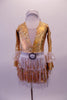 Gold leotard has a deep plunge V-front with nude mesh insert lined entirely with crystals. The long sleeves have alternating ruffled layers of white- silver polka dot and gold. The attached skirt is layers of white fringe over gold with a silver waistband that has a crystal buckle accent. Comes with a silver headband. Front