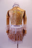 Gold leotard has a deep plunge V-front with nude mesh insert lined entirely with crystals. The long sleeves have alternating ruffled layers of white- silver polka dot and gold. The attached skirt is layers of white fringe over gold with a silver waistband that has a crystal buckle accent. Comes with a silver headband. Back