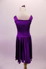 Stretch satin tank style purple dress has a wide shoulder strap. The bodice has a series of colour matched crystals in a large triangular shape and along the straps. Comes with matching floral hair accessory. Back