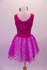 Magenta dress has sequined tank style bodice with scoop back. The skirt is sheer polka dot tulle and has a bow accent at the front centre of the waistband. Comes with matching sequined hair bow. Back