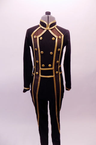 Black military style full unitard has gold piping and button accents. Bronze mesh inlays extend along the sides of the front torso and down the sides of the legs. The gold piping is used to create a faux waistband and cuffs. Front