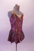 Merlot coloured leotard dress is velvet with gold swirl designs design, gold center inlay faux boning as well as a gold heart jewel at the bust. The short skirt has slight peaks with gold bead dangle accents. Comes with gold hair barrette. Side