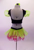 Two-piece costume dazzles with a silver-pink & green abstract leafy glitter design on black velvet. The top has line green organza pouffe sleeves & a green pure sequined pop-out bust edged in black lace ruffle. The matching shorts have a back bustle in lime green & hot pink organza. Comes with green hair flower. Back