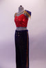 Marching band themed royal blue gold glitter pants have four gold button accents at the front. The accompanying red half-top has gold straps & three gold buttons at the front. Two large blue-gold epaulettes grace the shoulders edged with gold fringe. A gold beaded chain cascades from shoulder to shoulder on the chest. Side