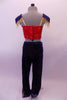 Marching band themed royal blue gold glitter pants have four gold button accents at the front. The accompanying red half-top has gold straps & three gold buttons at the front. Two large blue-gold epaulettes grace the shoulders edged with gold fringe. A gold beaded chain cascades from shoulder to shoulder on the chest. Back