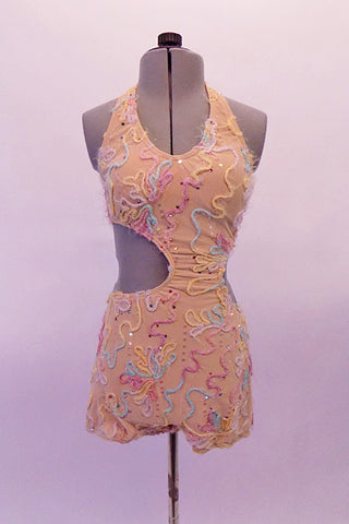 Nude alter neck leotard has side cutouts that are asymmetrically placed. The right side opens to the center front while the left has a smaller opening. The back is open except for the wide band that hold the front in place. The entire unitard in covered with pastel swirls of yarn and tiny crystals for a unique effect