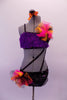 2-piece costume is attached by two crystal covered straps that extend from below the left bust across the front of the torso. The costume is a black base with colourful holographic dotted pattern. The brief has crystalled waistband & an orange-pink tulle accent at hip & the bust of the purple fur covered strappy bra. Front
