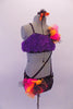 2-piece costume is attached by two crystal covered straps that extend from below the left bust across the front of the torso. The costume is a black base with colourful holographic dotted pattern. The brief has crystalled waistband & an orange-pink tulle accent at hip & the bust of the purple fur covered strappy bra. Right side