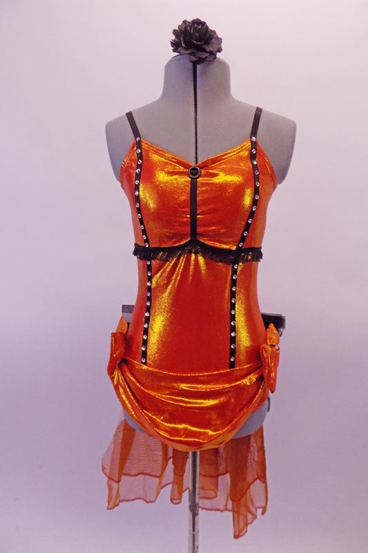 Iridescent orange leotard has crystalled black trimmed princess seams and lace below the bustline. The front is draped with bows at the hips. A long orange organza pouffe bustle with a large black tulle bow embellishes the back. Comes with a black floral hair accessory. Front