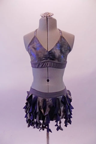 Grey and blue two-piece costume has a spiral ruffle skirt and matching bra top. The top has a halter neck and back double triangular straps covered in a double row of clear crystals for a stunning glow. Comes with crystal hair barrette. Front