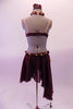 Deep burgundy two-piece costume has floral lace appliqued bra lined with crystals & nude straps. There is a gold & burgundy braided halter strap that attaches at the centre of the bust with small curly ruffle. The skirt with attached brief cascades long on the left side & has a matching braided belt & ruffle accent. Back
